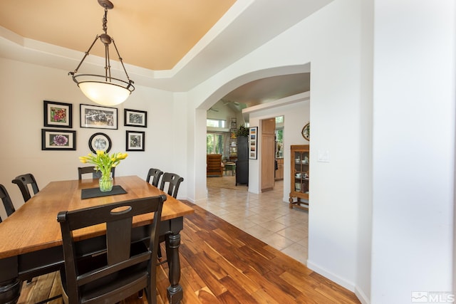 971 Fieldgate Way, Gardnerville, NV 89460 - dining area with arched walkways, light tile patterned floors, and baseboards