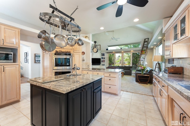 971 Fieldgate Way, Gardnerville, NV 89460 - kitchen featuring a ceiling fan, appliances with stainless steel finishes, light brown cabinetry, a sink, and vaulted ceiling