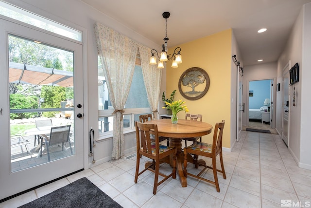 971 Fieldgate Way, Gardnerville, NV 89460 - dining space with a chandelier, a barn door, light tile patterned floors, recessed lighting, and baseboards