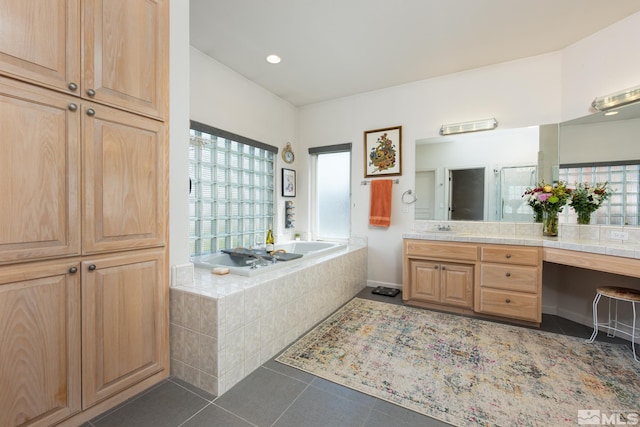 971 Fieldgate Way, Gardnerville, NV 89460 - bathroom featuring tile patterned floors, a garden tub, vanity, and a shower stall