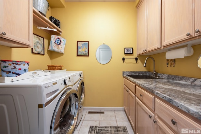971 Fieldgate Way, Gardnerville, NV 89460 - washroom featuring washing machine and dryer, baseboards, cabinet space, and light tile patterned flooring