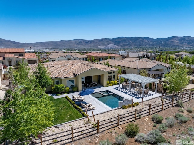 1009 Tremolite, Reno, NV 89511 - view of swimming pool featuring a residential view, a fenced backyard, a pool with connected hot tub, and a pergola