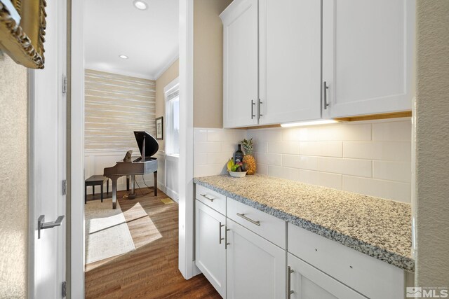 1009 Tremolite, Reno, NV 89511 - kitchen with dark wood finished floors, white cabinetry, backsplash, light stone countertops, and recessed lighting