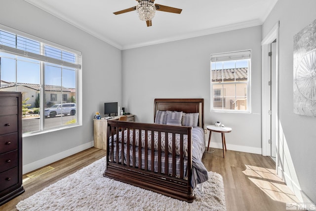 1009 Tremolite, Reno, NV 89511 - bedroom with crown molding, multiple windows, wood finished floors, baseboards, and a desk