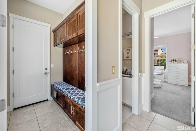 1009 Tremolite, Reno, NV 89511 - mudroom with light tile patterned flooring, a wainscoted wall, and light colored carpet