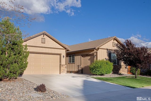 6680 Voyage Dr, Sparks, NV 89436 - ranch-style home featuring a garage, concrete driveway, a tiled roof, stone siding, and board and batten siding