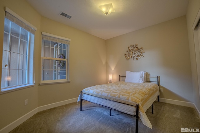 6680 Voyage Dr, Sparks, NV 89436 - carpeted bedroom featuring baseboards and multiple windows
