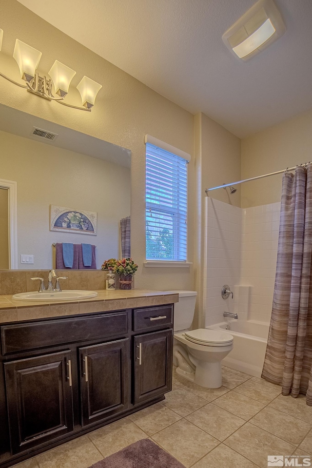 6680 Voyage Dr, Sparks, NV 89436 - full bath with vanity, tile patterned floors, toilet, and shower / bathtub combination with curtain