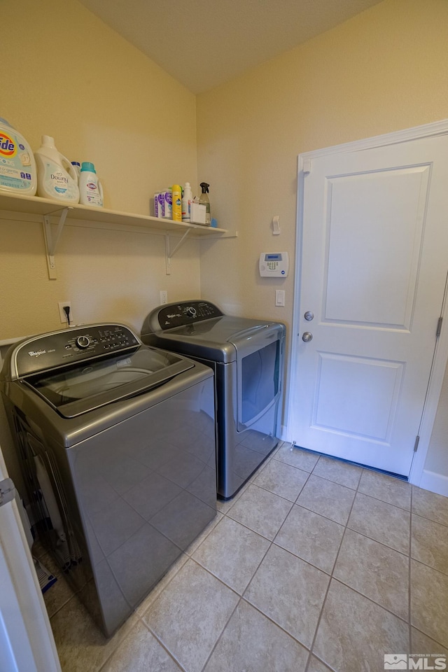 6680 Voyage Dr, Sparks, NV 89436 - laundry area featuring washing machine and dryer and light tile patterned floors