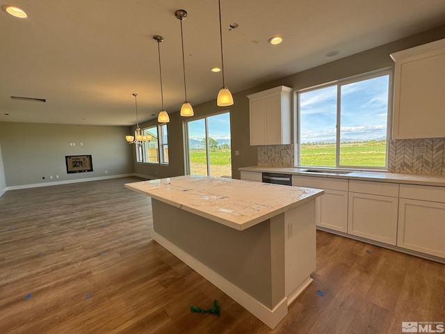 620 Sage Grouse Loop, Gardnerville, NV 89460 - kitchen with light countertops, dishwasher, dark wood finished floors, white cabinetry, and recessed lighting