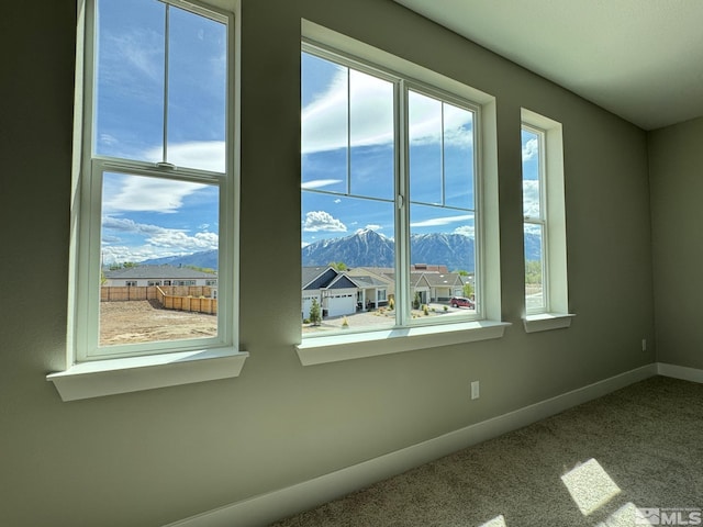 620 Sage Grouse Loop, Gardnerville, NV 89460 - carpeted empty room with a mountain view, healthy amount of natural light, and baseboards