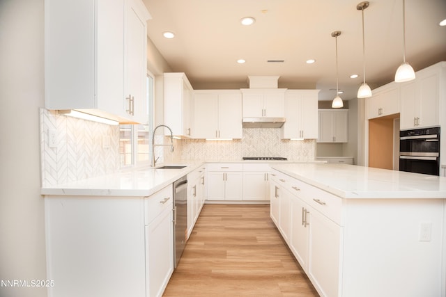 620 Sage Grouse Lp, Gardnerville, NV 89460 - kitchen featuring a sink, double oven, dishwasher, under cabinet range hood, and recessed lighting