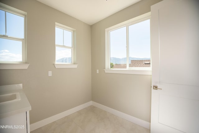 620 Sage Grouse Lp, Gardnerville, NV 89460 - laundry room featuring baseboards and healthy amount of natural light