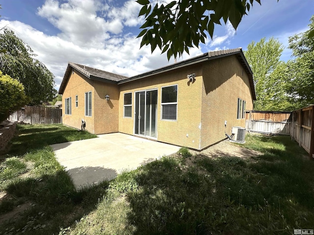 10599 Crystal Bay Dr, Reno, NV 89521 - rear view of property with central AC unit, stucco siding, and a patio area