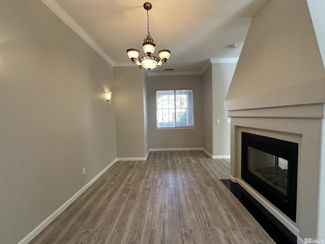 10599 Crystal Bay Dr, Reno, NV 89521 - unfurnished living room with wood finished floors, a glass covered fireplace, baseboards, ornamental molding, and a chandelier