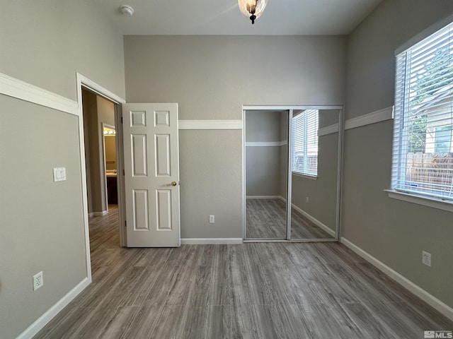 10599 Crystal Bay Dr, Reno, NV 89521 - unfurnished bedroom featuring wood finished floors, a closet, and baseboards