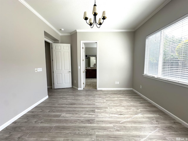 10599 Crystal Bay Dr, Reno, NV 89521 - unfurnished dining area with a chandelier, ornamental molding, baseboards, and wood finished floors