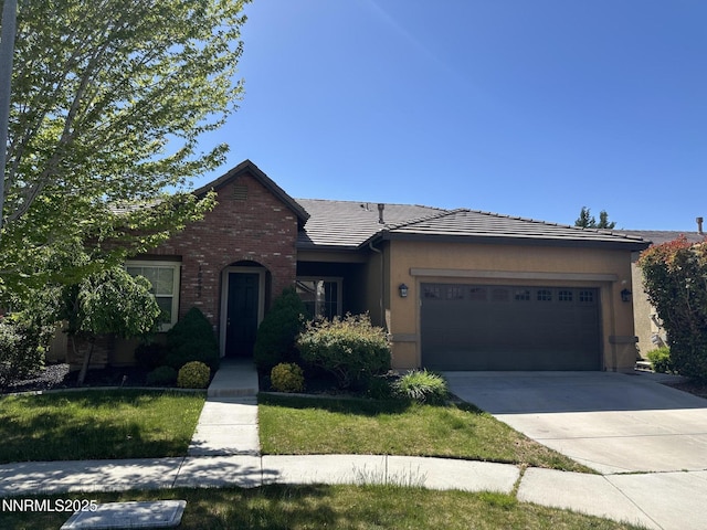 10599 Crystal Bay Dr, Reno, NV 89521 - view of front of house featuring an attached garage, a tiled roof, and driveway