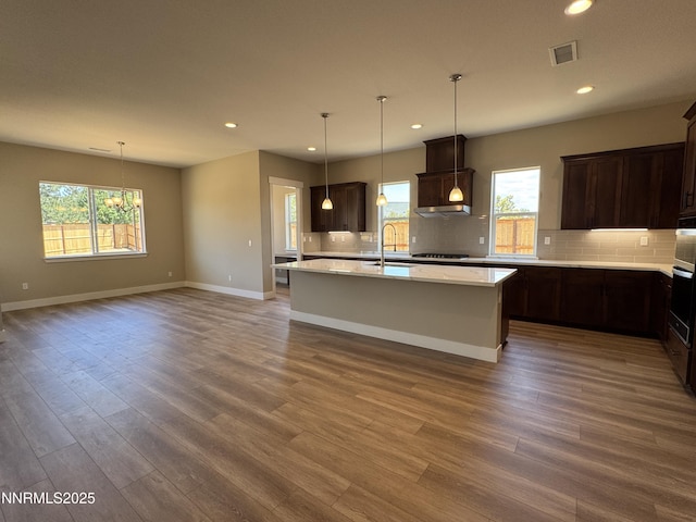 638 Sage Grouse Lp, Gardnerville, NV 89460 - kitchen with recessed lighting, tasteful backsplash, wood finished floors, and plenty of natural light