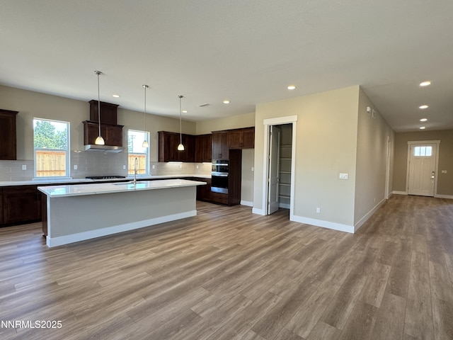 638 Sage Grouse Lp, Gardnerville, NV 89460 - kitchen featuring tasteful backsplash, light countertops, healthy amount of natural light, and recessed lighting