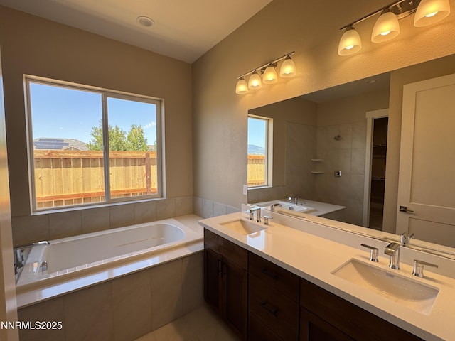 638 Sage Grouse Lp, Gardnerville, NV 89460 - bathroom featuring a garden tub, double vanity, and tile patterned floors