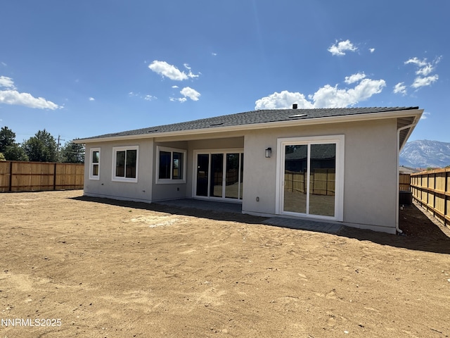 638 Sage Grouse Lp, Gardnerville, NV 89460 - rear view of property featuring a fenced backyard and stucco siding