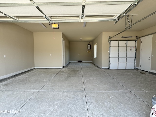 638 Sage Grouse Lp, Gardnerville, NV 89460 - garage featuring a garage door opener and baseboards
