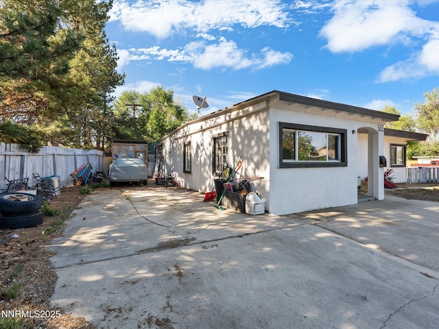 665 Southworth Dr, Reno, NV 89512 - view of home's exterior featuring stucco siding, driveway, and a patio area