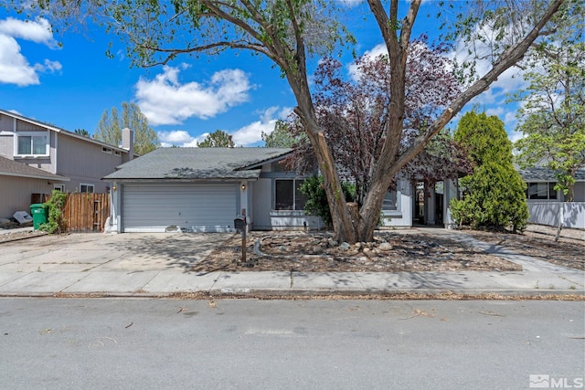 966 Woodstone Dr, Sparks, NV 89434 - view of front of house with a garage, driveway, and fence