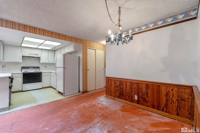 966 Woodstone Dr, Sparks, NV 89434 - kitchen featuring white appliances, a chandelier, light countertops, a textured ceiling, and under cabinet range hood