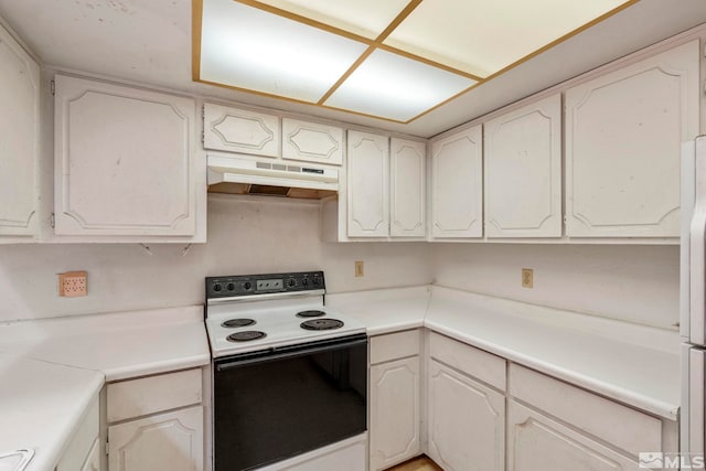 966 Woodstone Dr, Sparks, NV 89434 - kitchen with electric stove, under cabinet range hood, white cabinetry, and light countertops