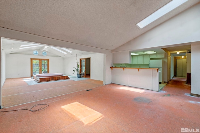 966 Woodstone Dr, Sparks, NV 89434 - unfurnished living room with lofted ceiling and a textured ceiling