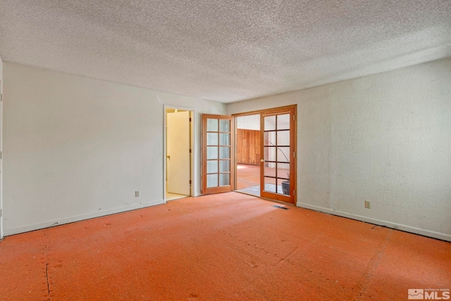 966 Woodstone Dr, Sparks, NV 89434 - carpeted empty room featuring baseboards, french doors, and a textured ceiling