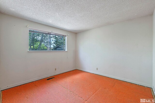 966 Woodstone Dr, Sparks, NV 89434 - unfurnished room featuring a textured ceiling and baseboards
