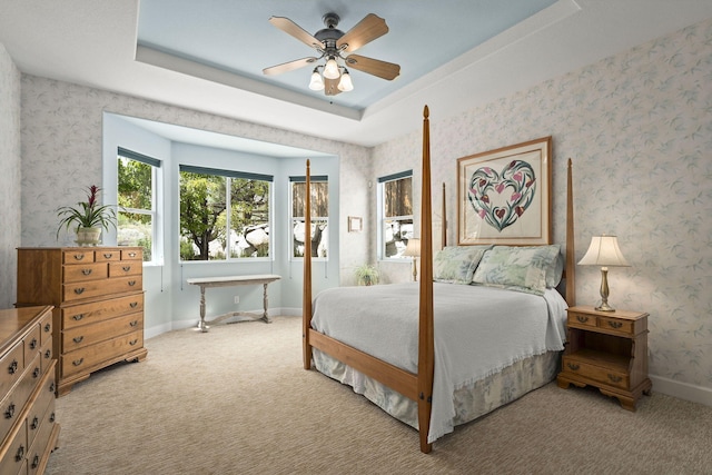 7735 Harvest Hill Ln, Reno, NV 89523 - bedroom with carpet floors, a raised ceiling, baseboards, and ceiling fan