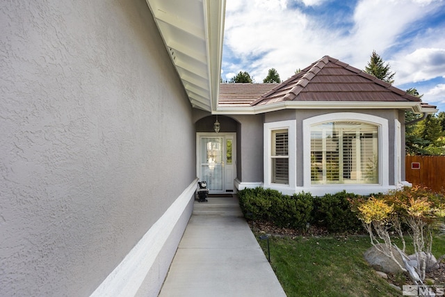 6525 Monticello Ct, Reno, NV 89519 - view of exterior entry featuring stucco siding and fence