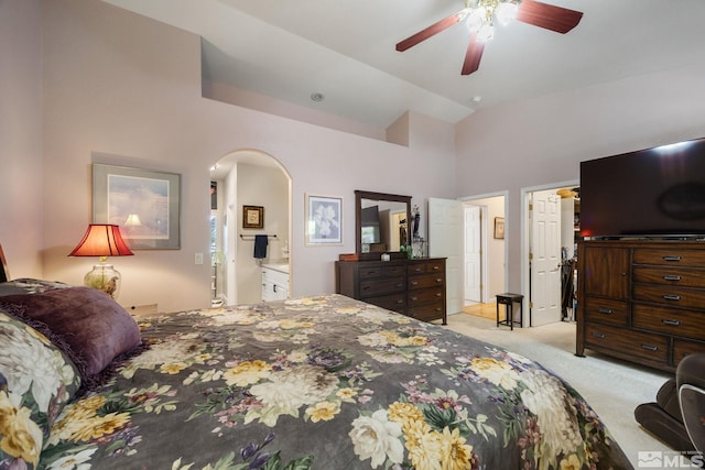 6525 Monticello Ct, Reno, NV 89519 - carpeted bedroom with arched walkways, a high ceiling, ceiling fan, and connected bathroom