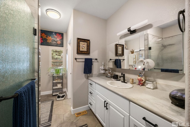 6525 Monticello Ct, Reno, NV 89519 - bathroom featuring a stall shower, tile patterned flooring, vanity, and baseboards
