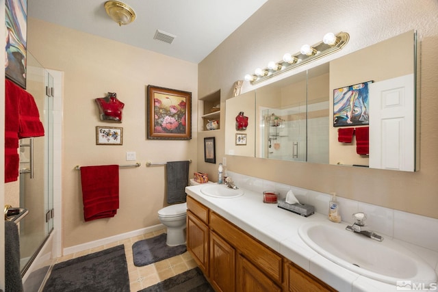 6525 Monticello Ct, Reno, NV 89519 - bathroom with toilet, double vanity, enclosed tub / shower combo, and baseboards