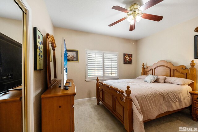 6525 Monticello Ct, Reno, NV 89519 - bedroom with light colored carpet, baseboards, and a ceiling fan