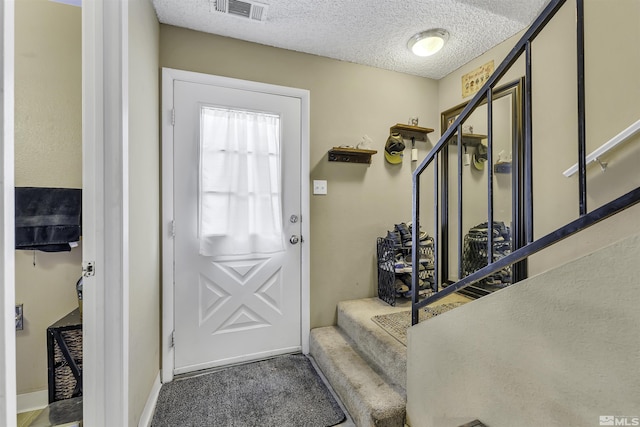 1064 Bradley Sq, Sparks, NV 89434 - foyer entrance featuring stairs, a textured ceiling, carpet, and baseboards