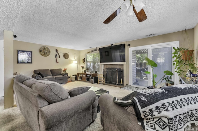 1064 Bradley Sq, Sparks, NV 89434 - carpeted living area with ceiling fan, a fireplace, and a textured ceiling