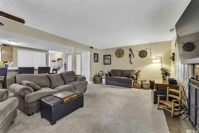 1064 Bradley Sq, Sparks, NV 89434 - carpeted living room with a textured ceiling