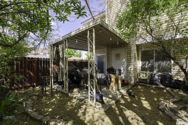 1064 Bradley Sq, Sparks, NV 89434 - back of house featuring fence and a chimney