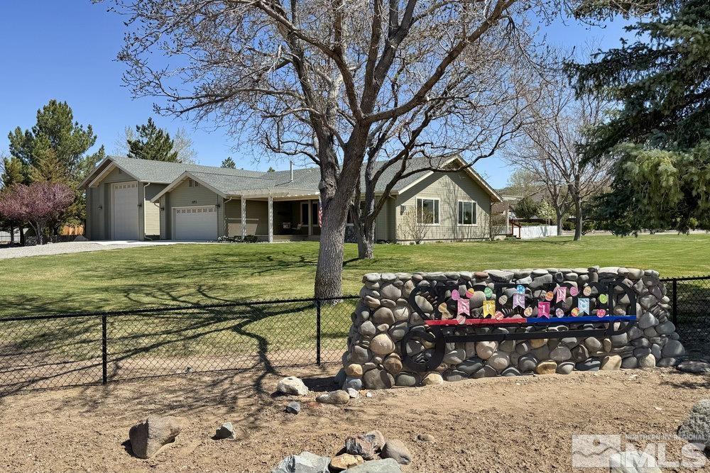 1051 Tenabo Ln, Gardnerville, NV 89410 - ranch-style house with an attached garage and driveway