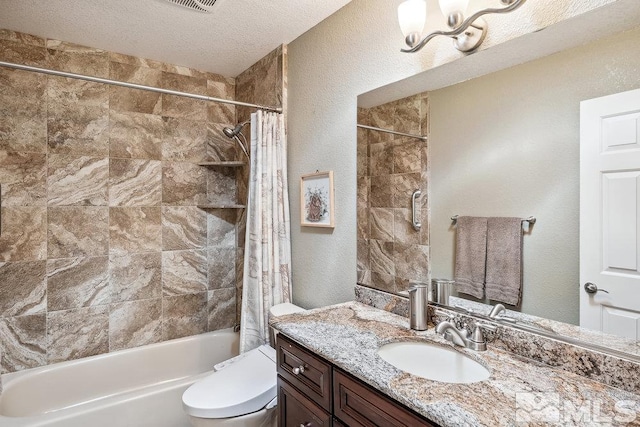 1051 Tenabo Ln, Gardnerville, NV 89410 - bathroom featuring shower / bathtub combination with curtain, vanity, toilet, a textured ceiling, and a textured wall