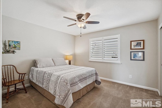 1051 Tenabo Ln, Gardnerville, NV 89410 - carpeted bedroom with baseboards and a ceiling fan