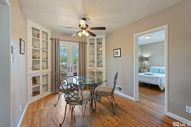2066 Plumas St, Reno, NV 89509 - dining room featuring wood finished floors, french doors, a ceiling fan, and baseboards