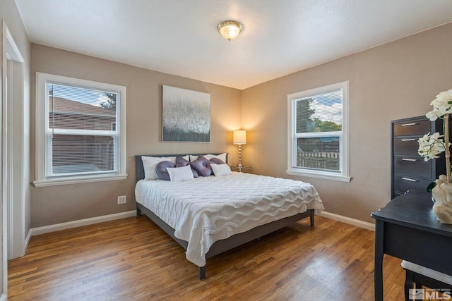 2066 Plumas St, Reno, NV 89509 - bedroom featuring baseboards and wood finished floors