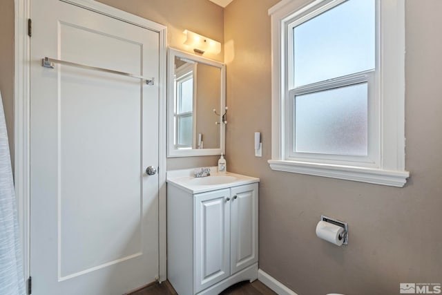 2066 Plumas St, Reno, NV 89509 - bathroom with healthy amount of natural light, vanity, and baseboards